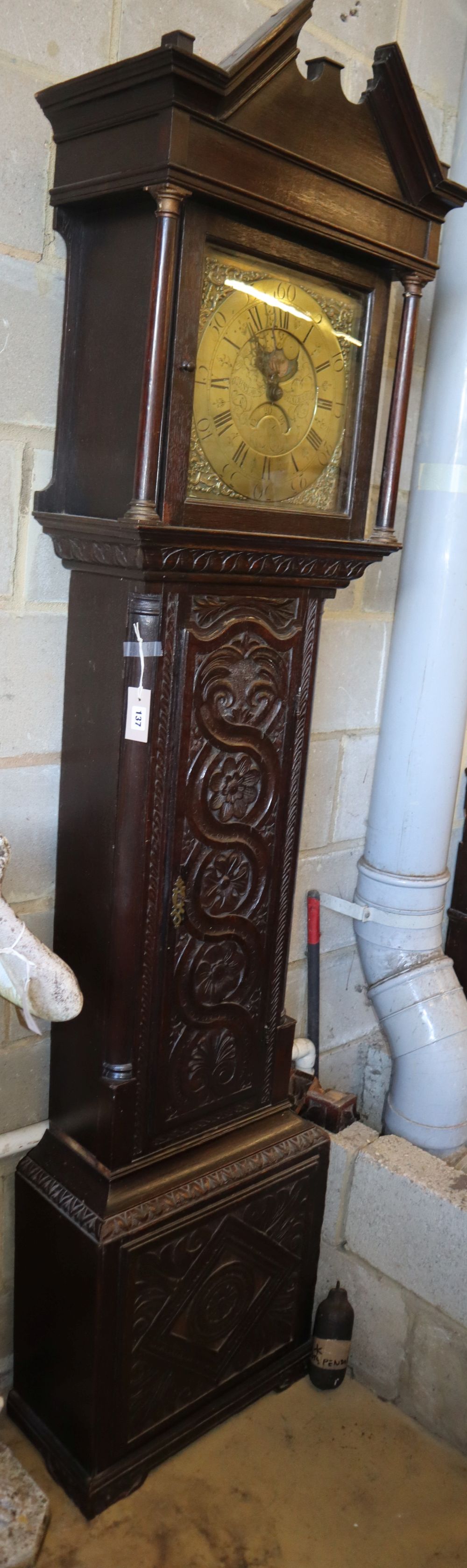 A George III oak 30 hour longcase clock, later carved, the brass dial marked John Lawson, Bradford, case later carved, W.49cm, D.24cm,